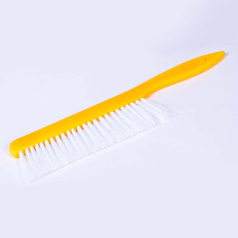 Brush with nylon bristles to gently sweep bees from the frame