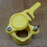 Yellow and orange guillotine cut tap with tie rod and hands